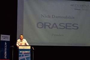 Orases employee at podium giving speech 