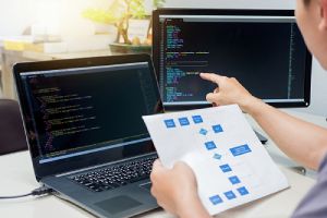 A Programmer working on a custom software development for SaaS project