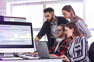 Devops team members working on a custom software development project