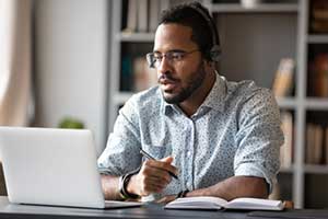 Man working on SaaS software on a web browser