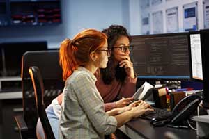 Two custom software developers upgrading a legacy system
