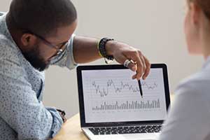 Man reviewing data on his custom CRM software