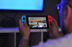 Man playing Nintendo Switch