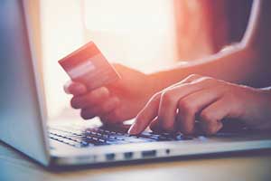 Woman purchasing goods off an e-commerce web application