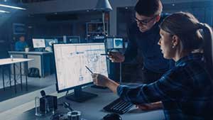 Employees using custom ERP software solutions