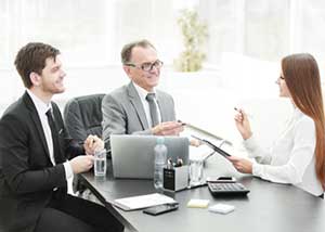Managers reviewing their custom CRM software