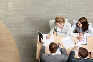 Employees collaborating through their custom ERP solution