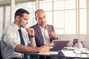 Business owners researching how to prepare for a software migration project