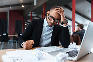 Man deciding which web portal development company to choose