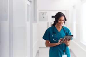 nurse walking using her Custom Patient Portal