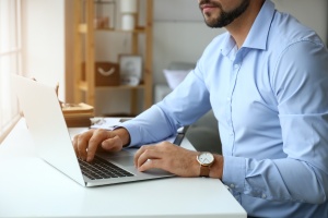 men working at home on a Custom Web Portal 