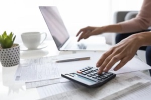 company owner calculating cost