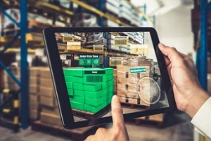 man scanning warehouse items