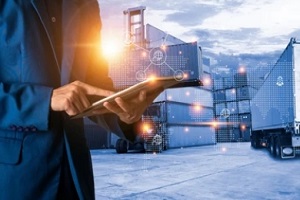 man using laptop in containers in backgrounds
