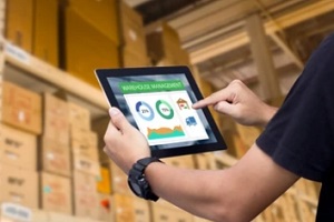 man using laptop for warehouse management