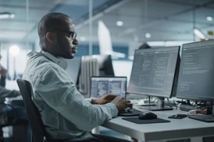 man working on computer system