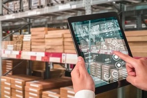 man using tablet in inventory