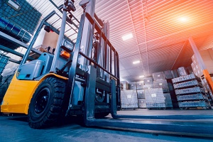 forklift loader pallet stacker working through a warehouse picking orders through wms