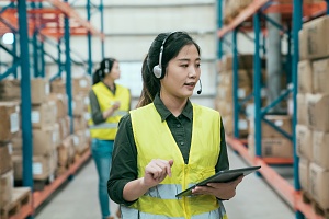 two business women using wms to communicate inventory counts