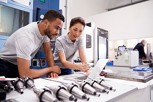 two programmers reviewing the scope of a project to create a mrp solution