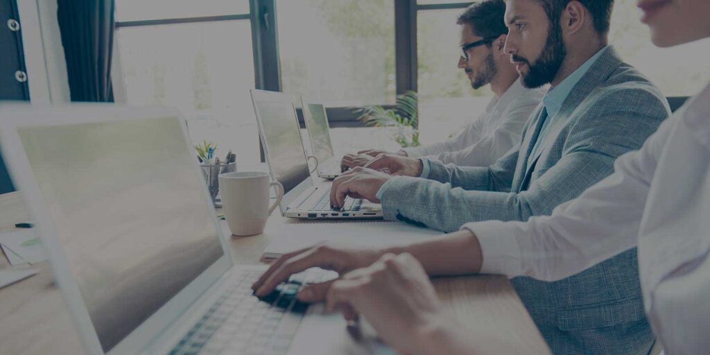 Employees performing software product modernization services
