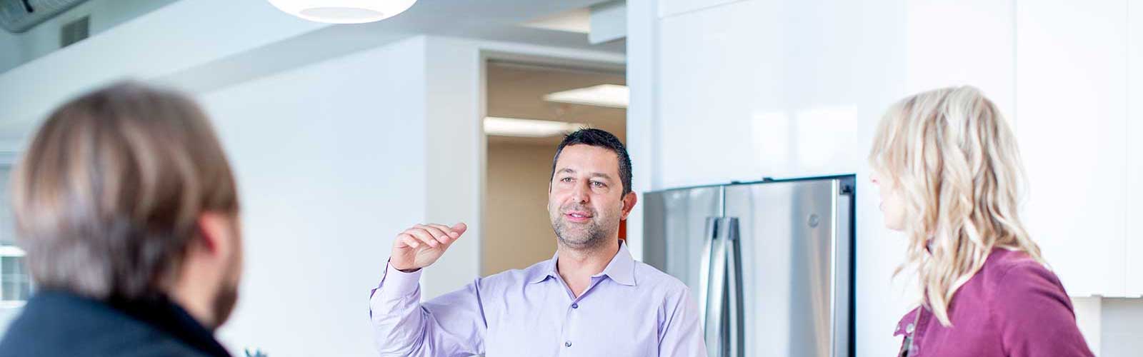 Orases CEO chatting with custom software developers