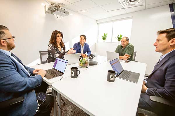 Orases development team discussing new CFMA website design