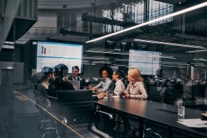 professional sitting at a table discussing industrial internet of things