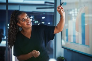 young professional reviewing data in a presentation
