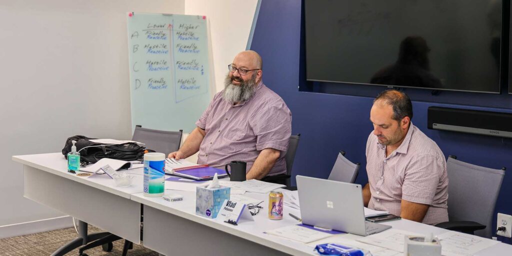 Orases software developers having a meeting about their new ehr integration project
