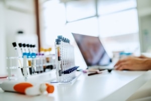medical scientist looking at the latest health data findings in their lab