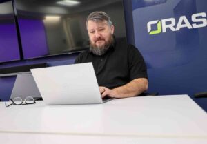 orases team member on a teleconference about their asset management consulting services