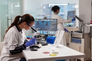 scientists looking at covid samples to gather data for healthcare services