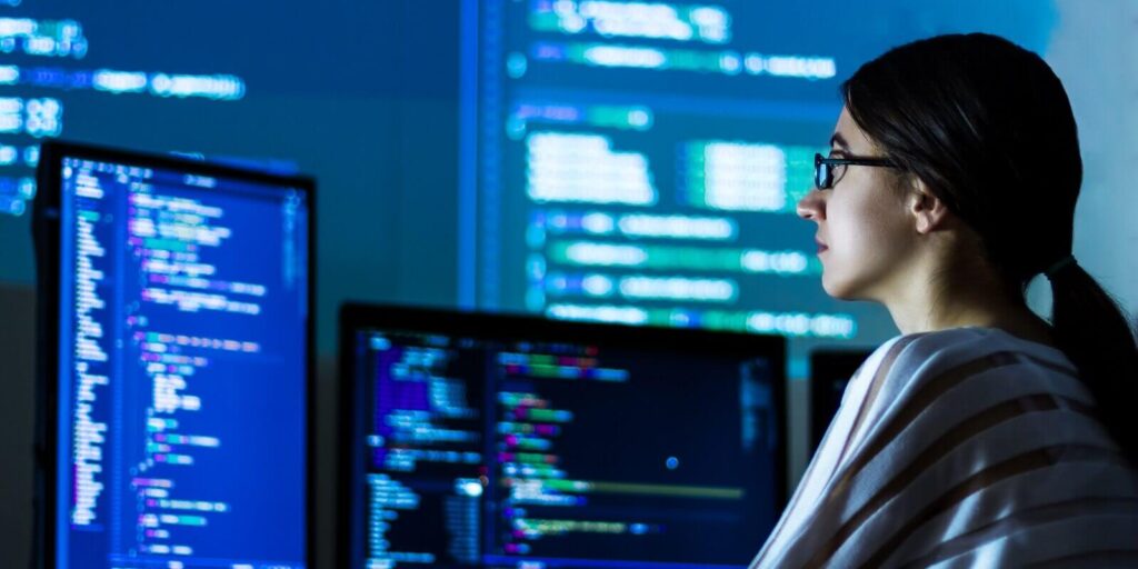 developer freelancer woman female in glasses work with program code