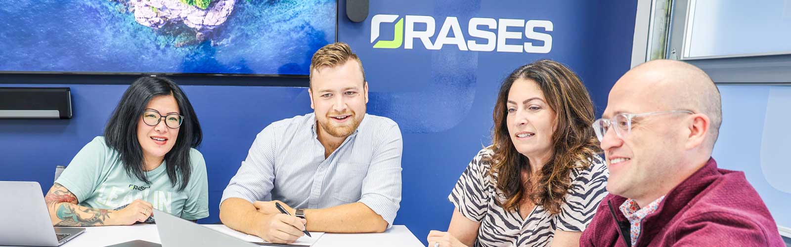 Orases project managers in team meeting