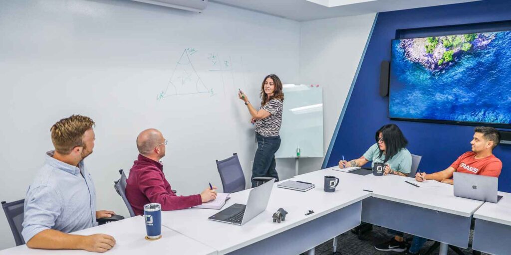 Orases team mapping out new custom insurance policy management software project