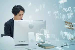 man working on apple computer