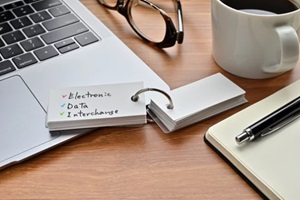 the word electronic data interchange is written on note