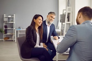 couple customers having consultation with lawyer, real estate or insurance agent
