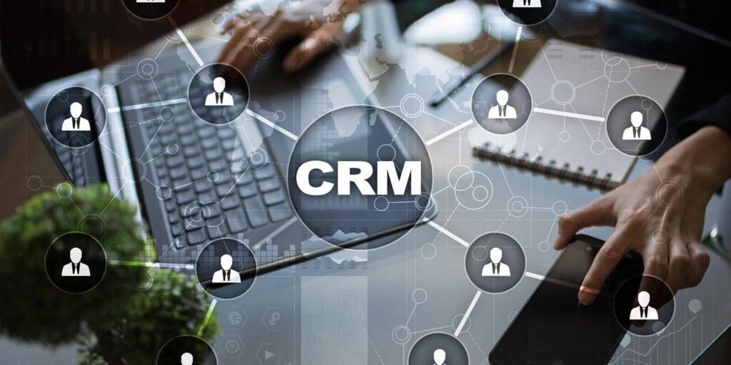 customer relationship management concept with a man working in blurred background