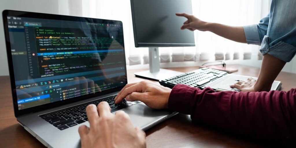 programmer working to find solution to problem and coding technologies in a custom software developing company office