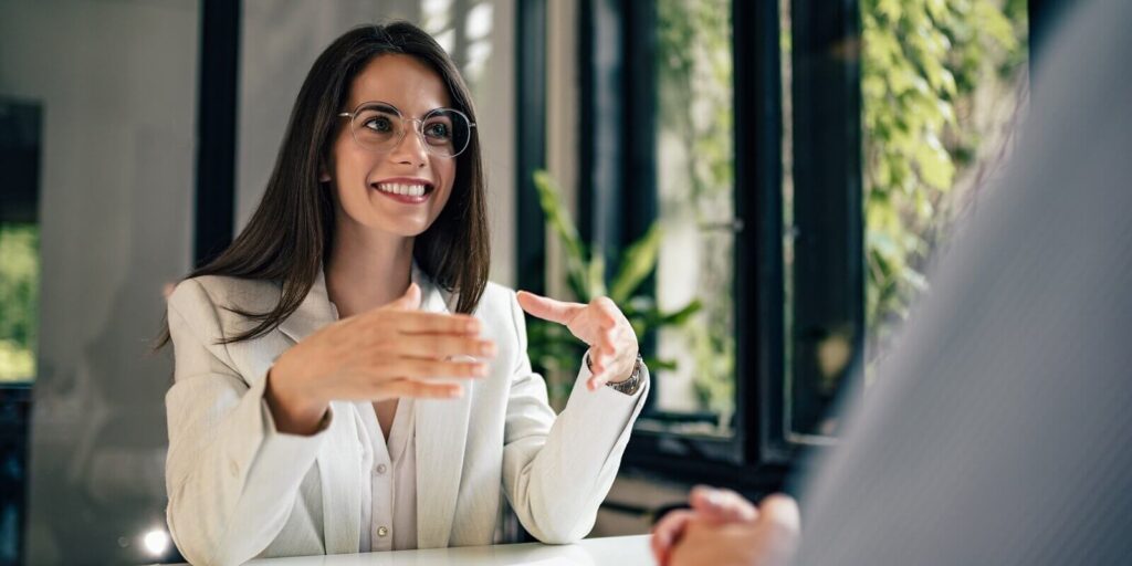 beautiful female financial adviser talking to a client