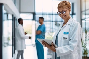 doctor and tablet on healthcare software at hospital for innovation