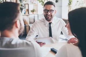 financial advisor with young couple