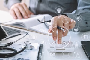 hand of smart doctor used a calculator for medical costs in modern hospital