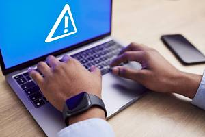laptop screen with warning error signal
