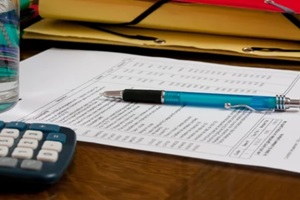 pricing document with pen on it