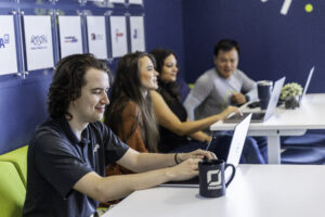 Orases team member working on their laptop 