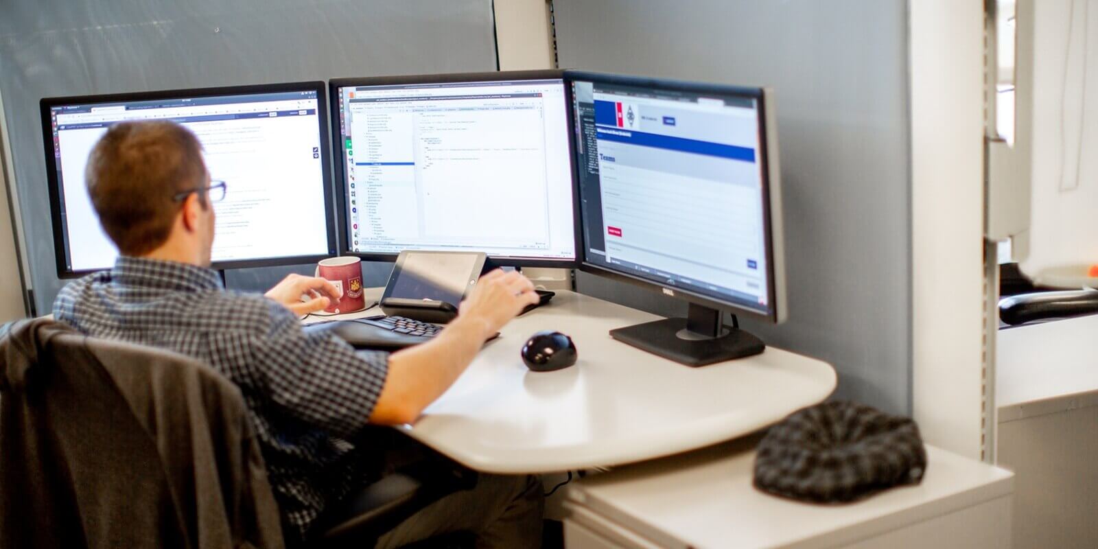 man working on computers
